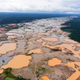Illegal gold mines cut through the Peruvian Amazon.
